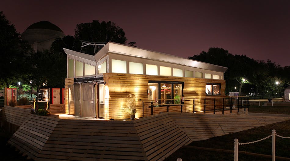 LED lights strategically placed in the base of the house and deck help the University of Wisconsin-Milwaukee&rsquo;s solar-powered home illuminate at night during the lighting contest at the U.S. Department of Energy Solar Decathlon on the National Mall in the Washington, D.C., Monday, Oct. 12, 2009.
