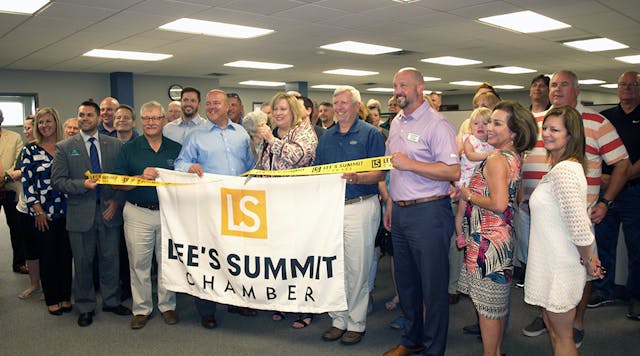 CBM and the Lee&rsquo;s Summit Chamber of Commerce held a ribbon-cutting ceremony at the new office on June 25. Among the CBM employees greeting guest at the event were (center, by banner) Larry Burchett, V.P. Utility Business Group; Brett Cooper, V.P. Communications Business Group; Marla Sparks, president, CEO; and Doug Mayle, V.P., Contractor/Industrial Business Group.