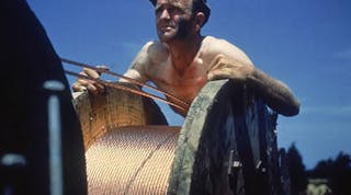 A worker laying cable for Fort Knox, June 1942 Alfred T. Palmer/Hulton Archive/Getty Images