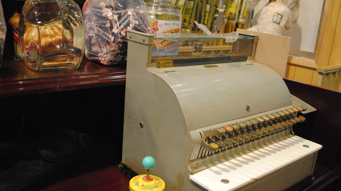 An oldtimey cash register was among the artifacts used in the store